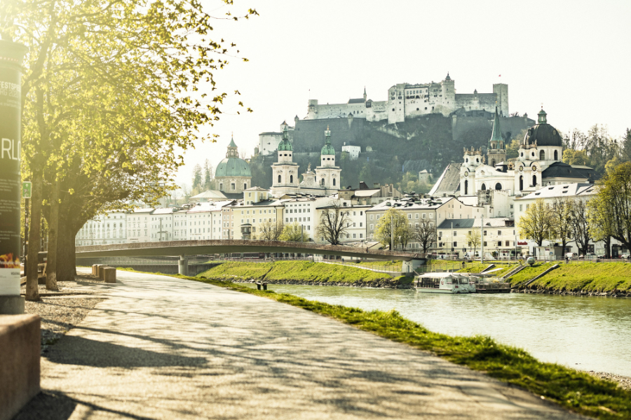 Hohensalzburg Fortress with the cathedral and the Salzach River in the foreground.